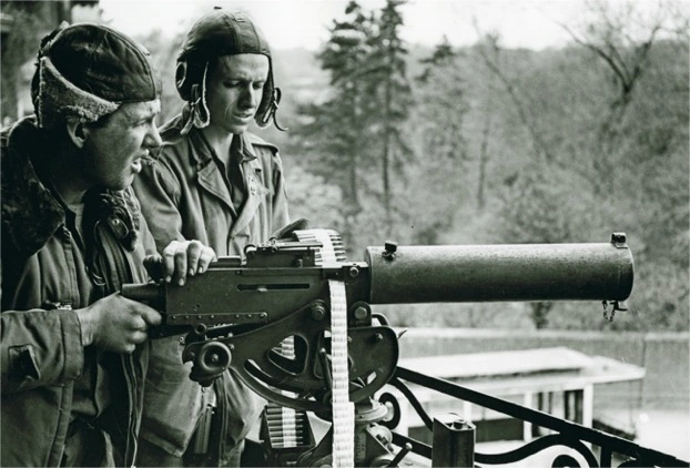 Robert Capa: The two soldiers Private Raymond J. Bowman (right) and Clarence Ridgeway (left) on the balcony of the second-floor flat at Frankfurter Straße 61 on April 18th 1945